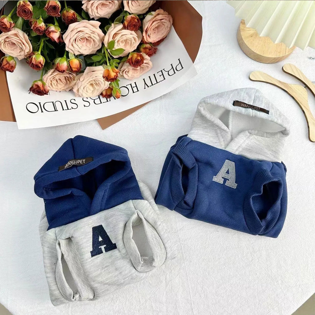 Blue polyester pet hoodie with reflective letters on a dog, slim-fitting design for cats and dogs
