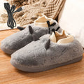 USB electric heating slippers with soft velvet upper and plastic sole, showing adjustable temperature control.