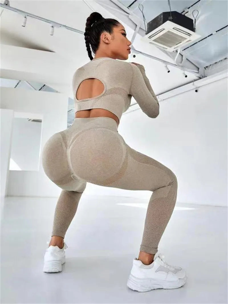 Two-piece sports suit with long sleeve hollow top and high waist seamless leggings in green