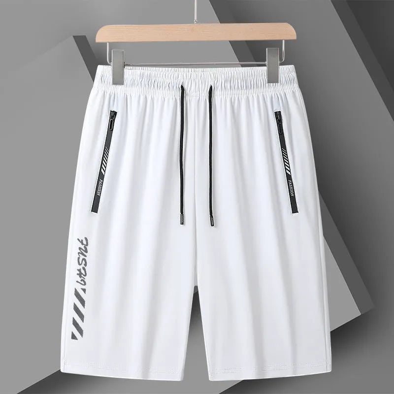Men's quick-drying nylon sports shorts in loose fit with fifth length and medium elastic waistband