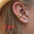 Gold starfish and conch shell drop earrings for women with animal zodiac design