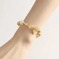 Gold electroplated rutilated quartz bracelet with ringing bell design in Korean style