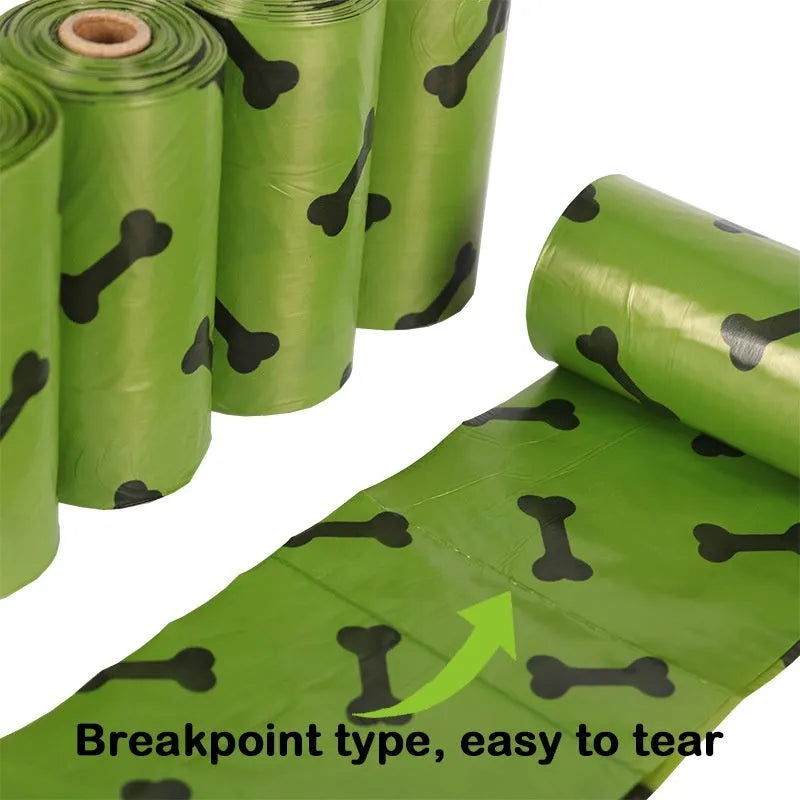 Military green degradable dog poop bags with black bone print, rolled with dispenser