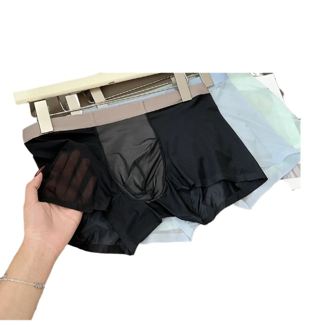 Seamless men's boxers in black showing ultra-thin fabric and mid-waist design.