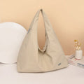 Women's heart-shaped nylon underarm bag in black, yellow, khaki and blue colour options