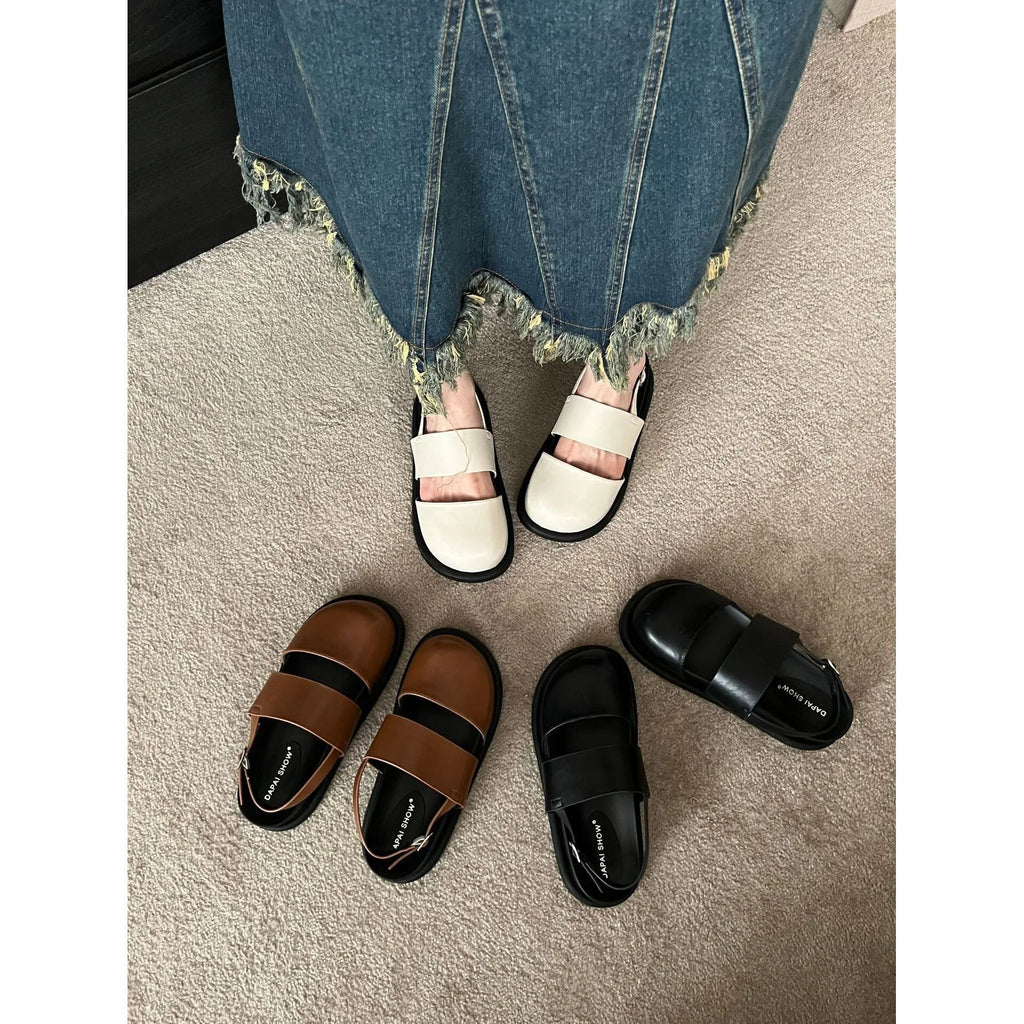 Retro women's sandals with a closed toe, ankle strap buckle, and platform sole in apricot colour.