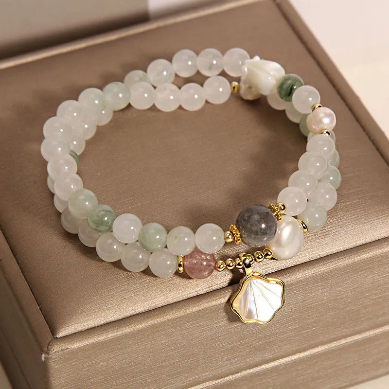 Women's crystal bracelet with gold-plated Tianshan jade shell ginkgo leaf pendant and rhinestone accents