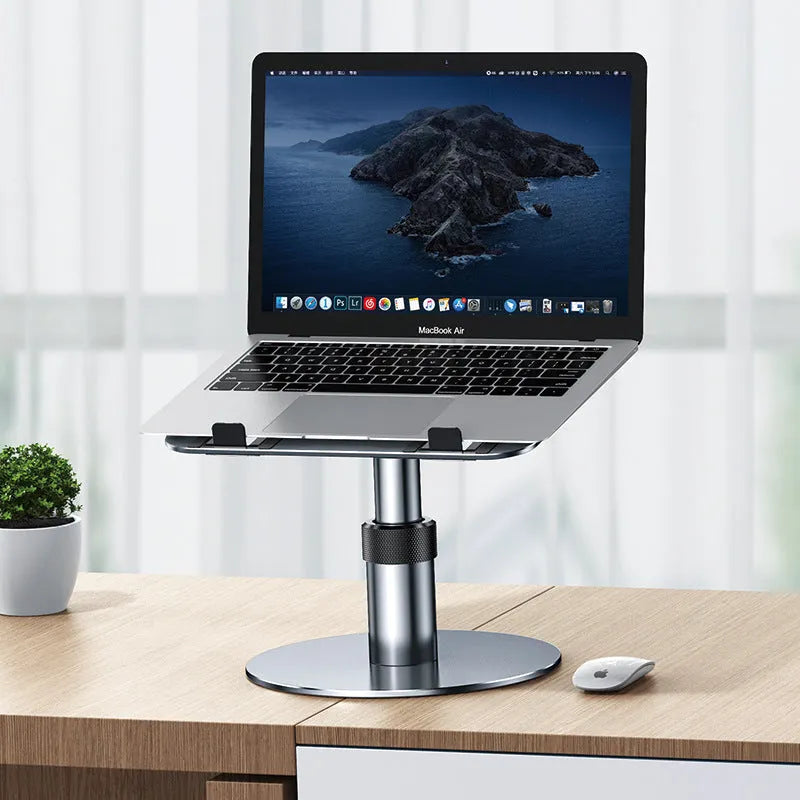 Silver aluminium car laptop stand with adjustable height and a 360-degree rotating base on a car seat.