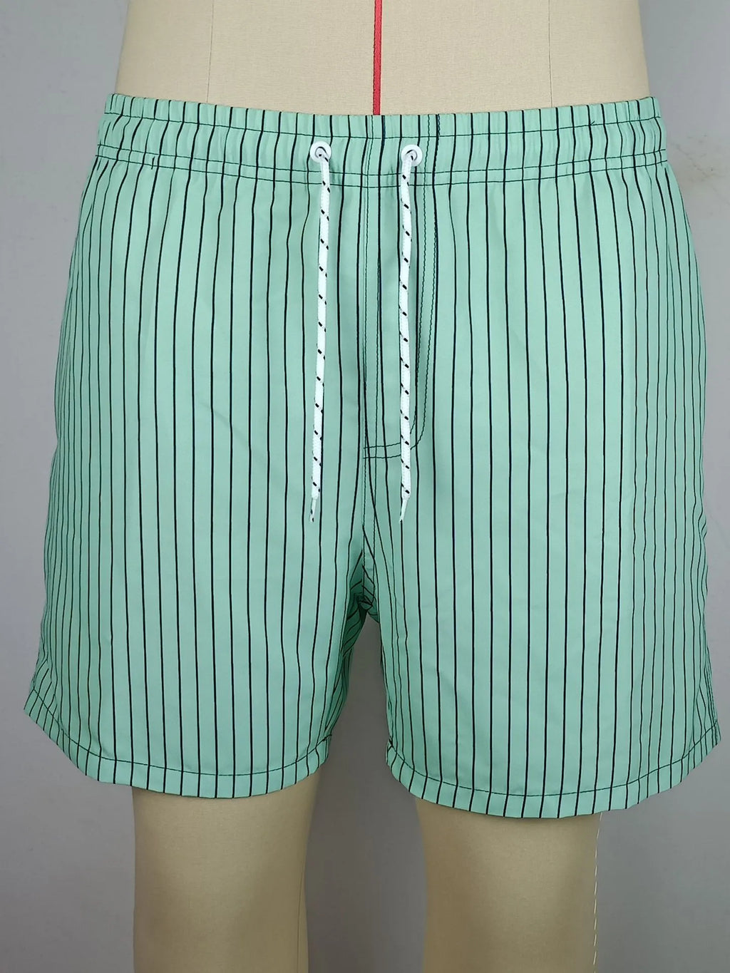 Men's navy blue striped beach shorts with triangle lining and straight leg opening