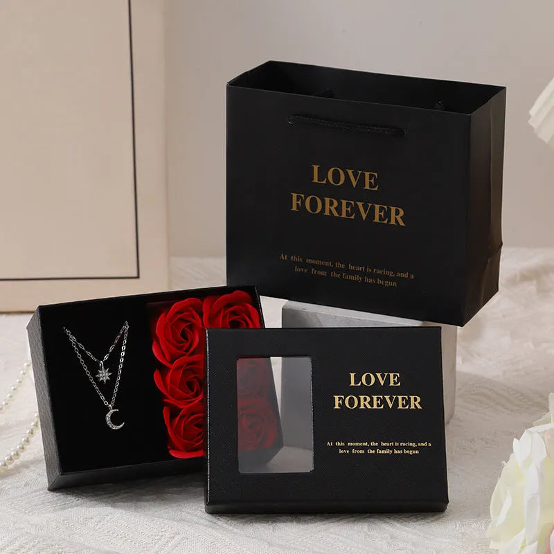 Korean style gift box containing six red soap roses with a matching handbag.