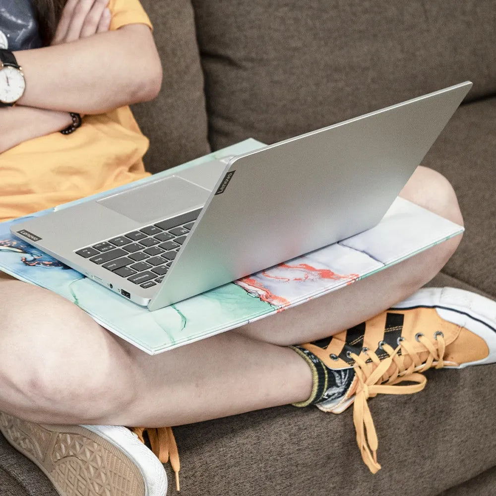 Soft PVC heat-insulating anti-radiation pad for laptops in black, blue, green, and black gold colours.