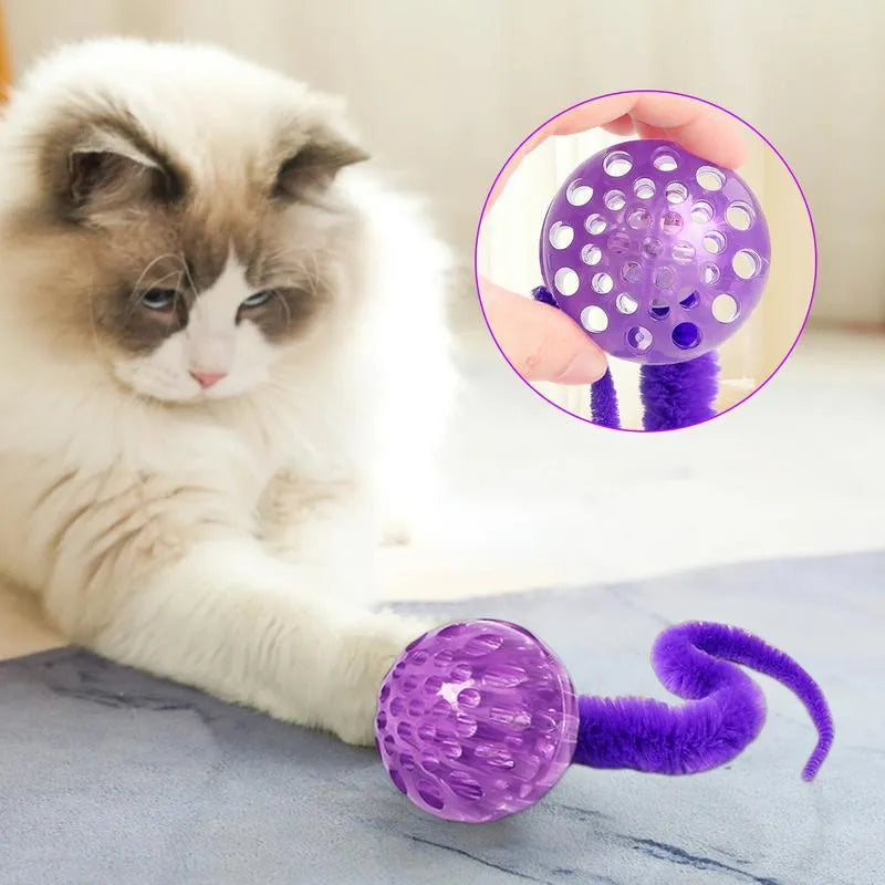 Interactive cat ball toy with worm tail in green on light background