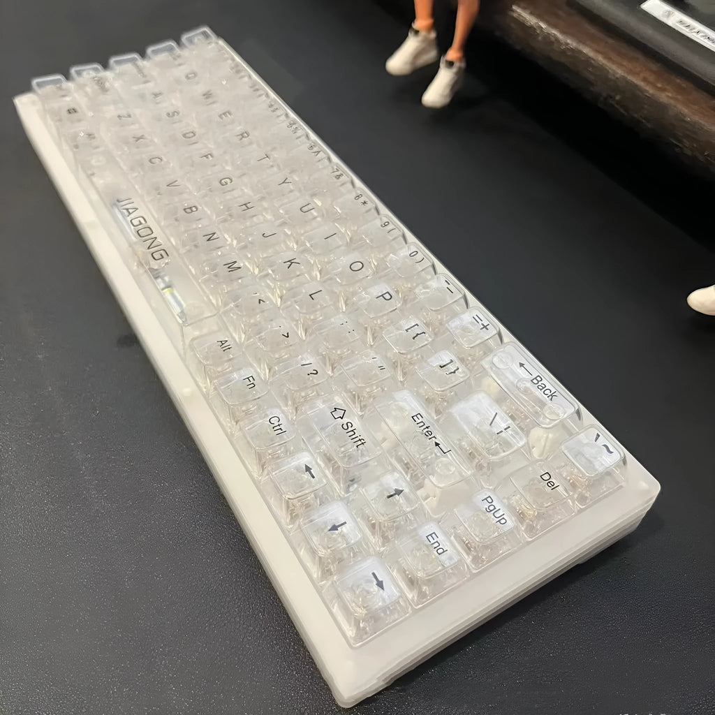132 transparent plastic key caps for mechanical keyboard customisation arranged in full keyboard layout