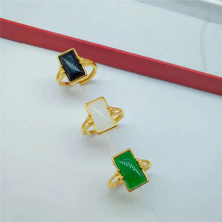 Adjustable brass ring with gold-plated finish and electroplated gemstone inlay