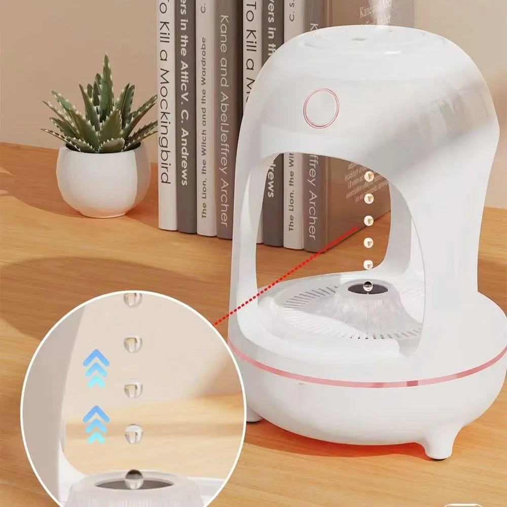 Anti gravity levitating water drops ultrasonic humidifier with LED night light in rose gold and white colour on a desk