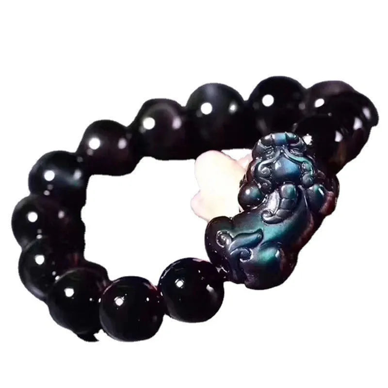 Natural ice colour eye obsidian crystal bracelet on wrist showing bead size.