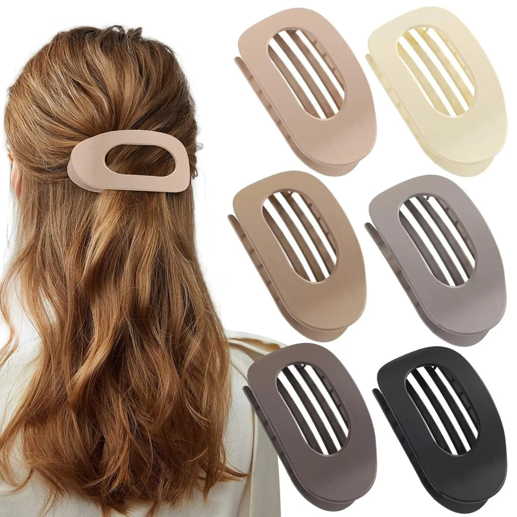 Six Rose Red plastic hair clips with a quadrilateral shape and frosted grip, laid out on a surface.