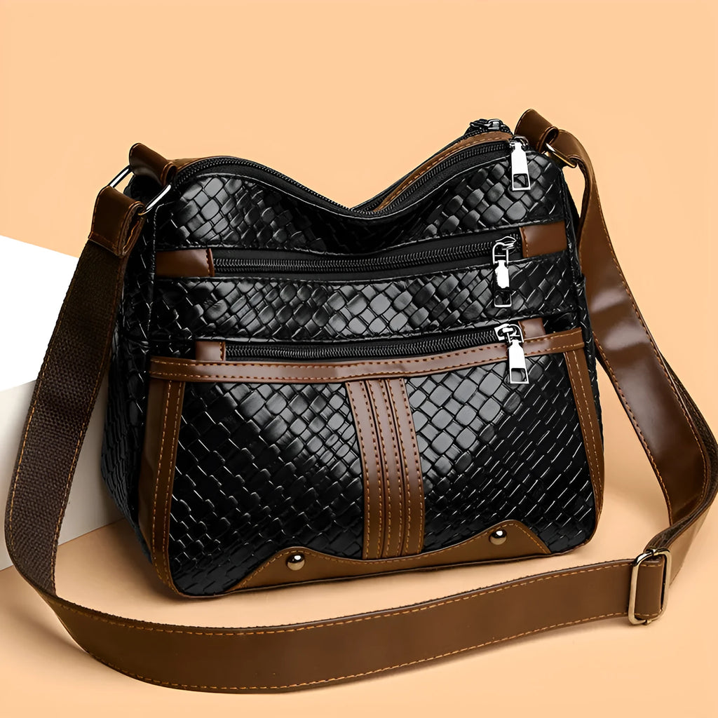 Multi-compartment woven PU messenger bag in brown, horizontal shape with single shoulder strap