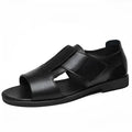 Men's black leather casual Roman sandals with an open toe and rubber sole on a neutral background.