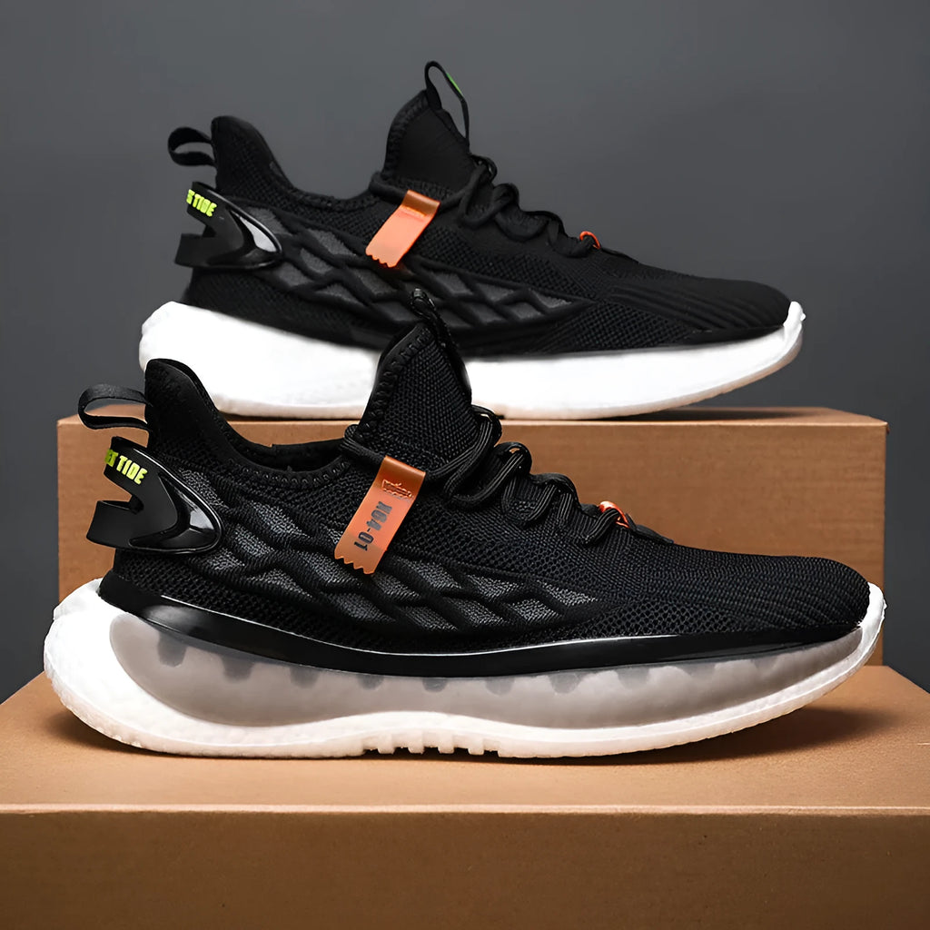 Men's casual sneaker with woven mesh upper in black colour showing round toe and lace-up design
