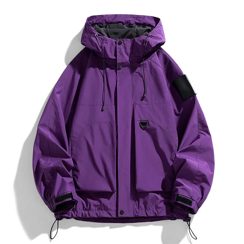 A man wearing a black windproof waterproof hooded jacket made from polyester blend fabric.