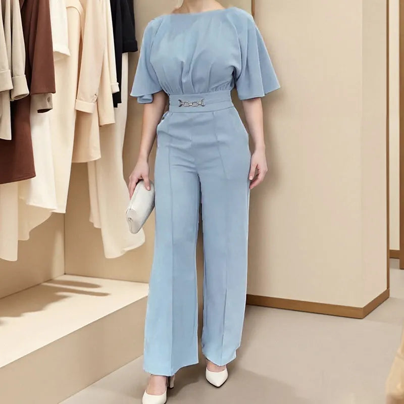 Blue men's casual polyester suit with trousers and a long-sleeve jacket on a hanger.