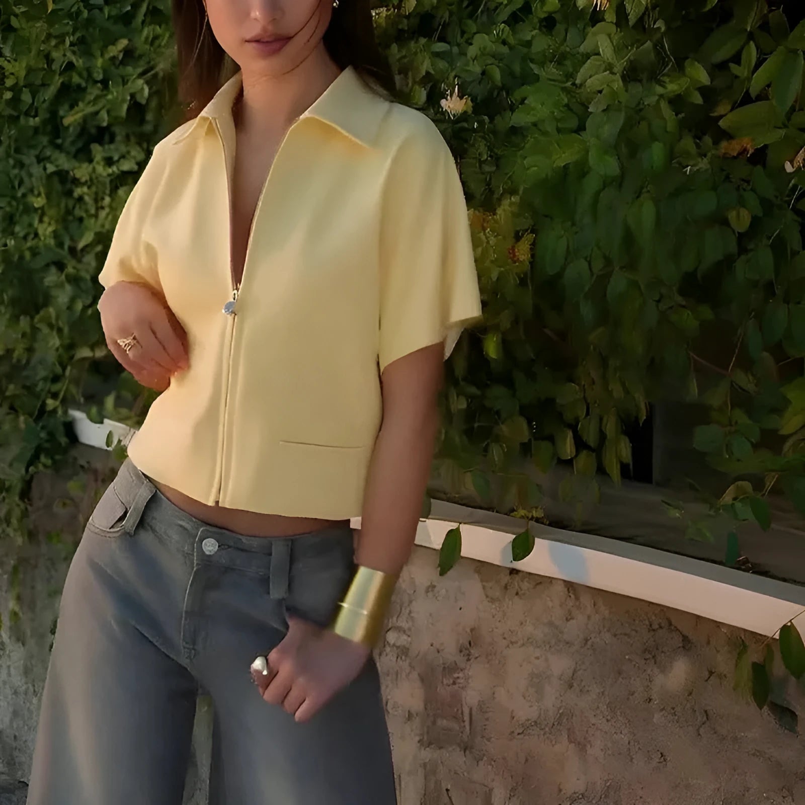 Woman wearing a loose-fitting white damascus-pattern short sleeve polyester casual shirt.