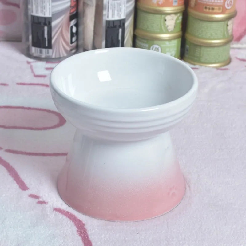 Ceramic anti-tumble pet bowl for dogs and cats with high foot and neck protector.