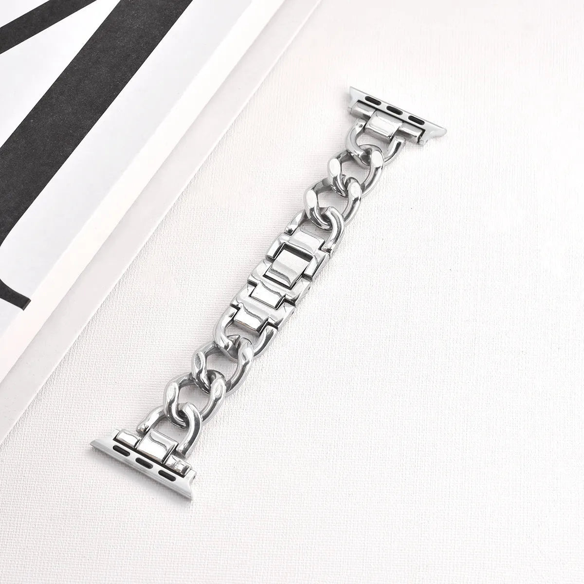 Metal chain link watch strap for Apple Watch in silver, black, gold, rose gold, or Starlight colour.
