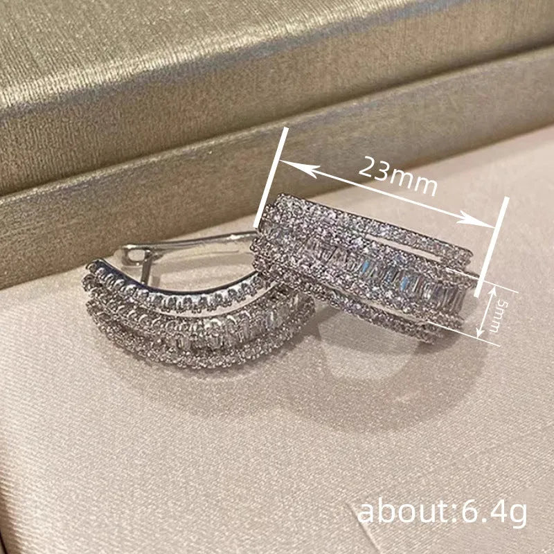 Geometric stud earrings with white gold colour finish and zircon inlaid decoration
