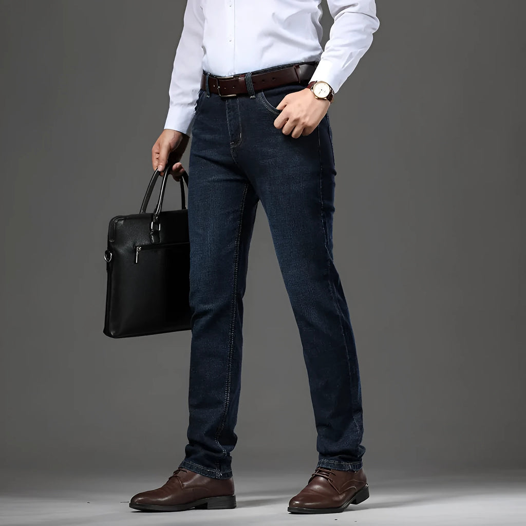 Women's loose fit black stretch jeans with a straight leg and zip fly, shown on a hanger.