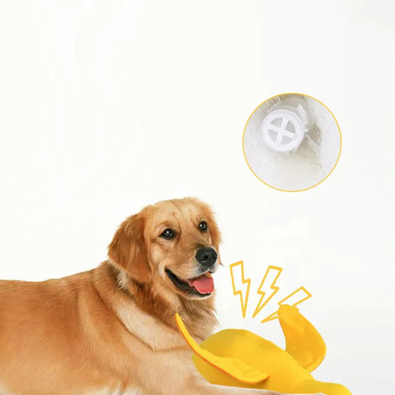 Yellow plush duck dog toy with squeaker and treat dispensing holes for training and chewing.