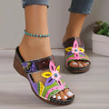 Ethnic colourful slope and totem design slippers in cowhide leather with a rubber sole.