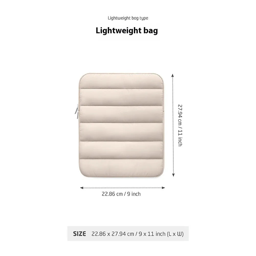 Black elastic puff bag laptop sleeve for 9.7 to 11 inch devices on a table