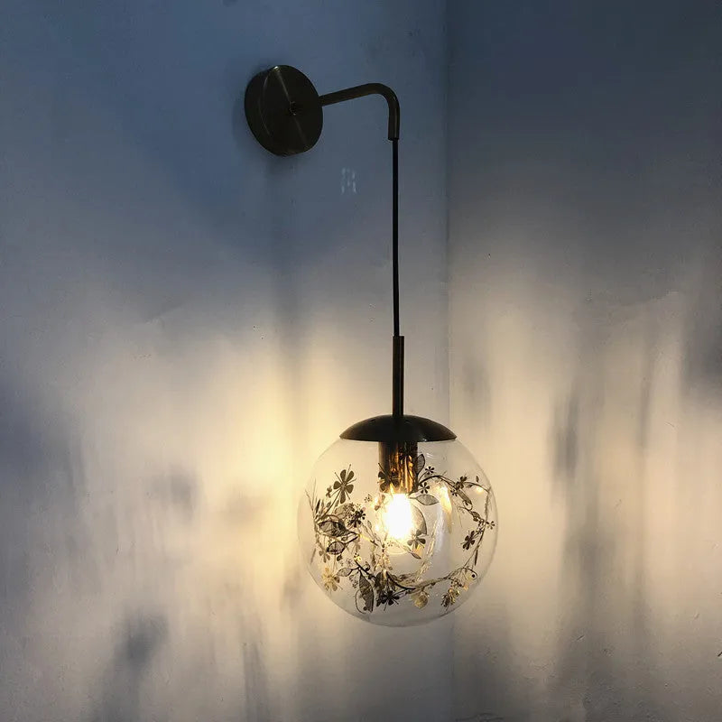 Modern glass wall lamp in golden flower finish, 20cm diameter, mounted on wall
