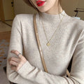 Slim fit viscose fibre knitted shirt with long sleeves in apricot colour showing front view