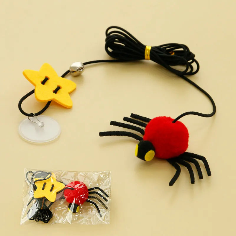 Red and yellow hanging door cat toy with swinging elastic rope, feather, and bell attachments