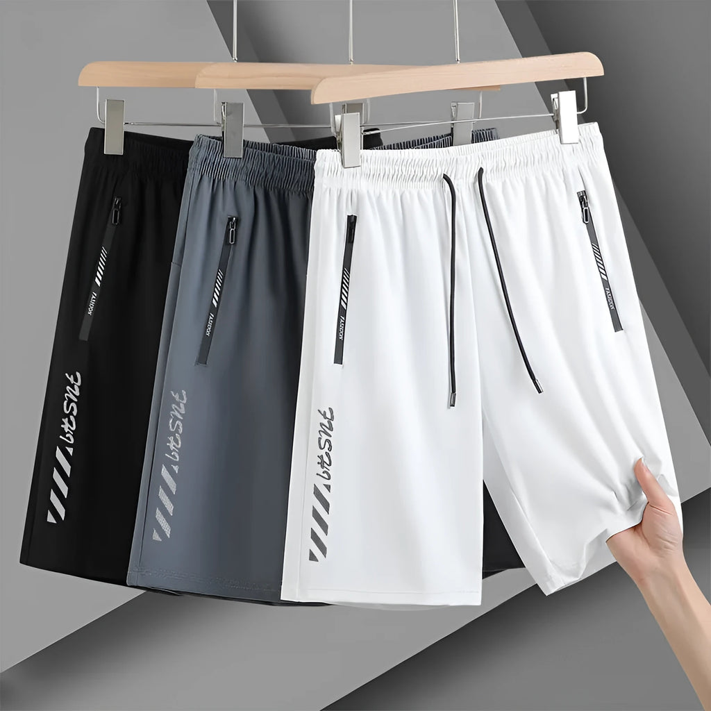 Men's quick-drying nylon sports shorts in loose fit with fifth length and medium elastic waistband