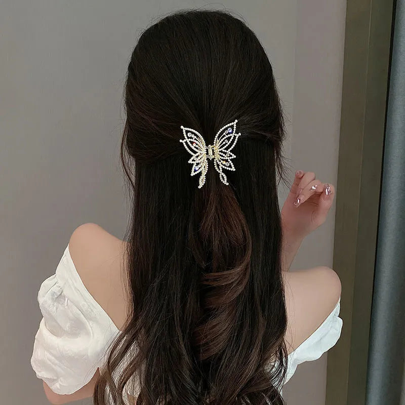 Butterfly-shaped alloy hair clip barrette for women, available in rhinestone or pearl style.