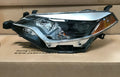 Toyota Corolla passenger-side halogen headlight assembly with integrated cornering lamp.