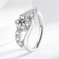 White gold colour crown-shaped copper ring on a plain background