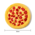 Yellow pizza slice dog chew toy with squeaker and dental grinding surfaces
