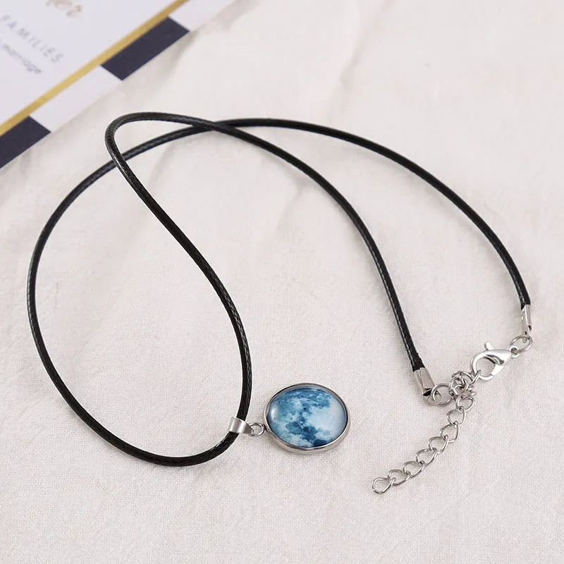 Constellation night sky pendant necklace with luminous alloy and organic glass on an adjustable chain.