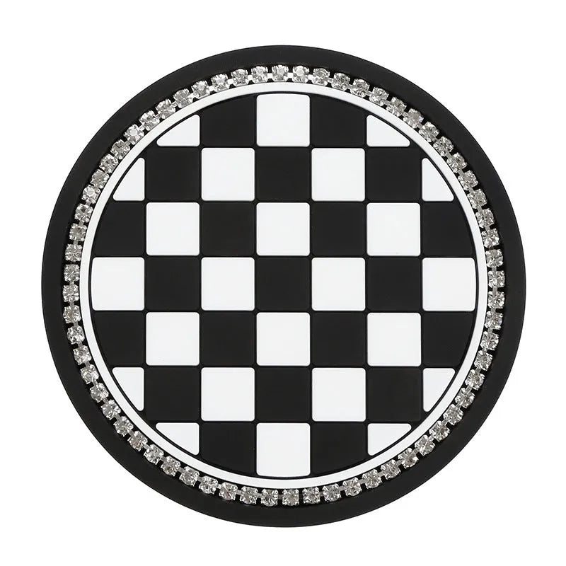 Plastic car water cup mat in black and white checkerboard with drill detailing on a non-slip surface for cup holder use
