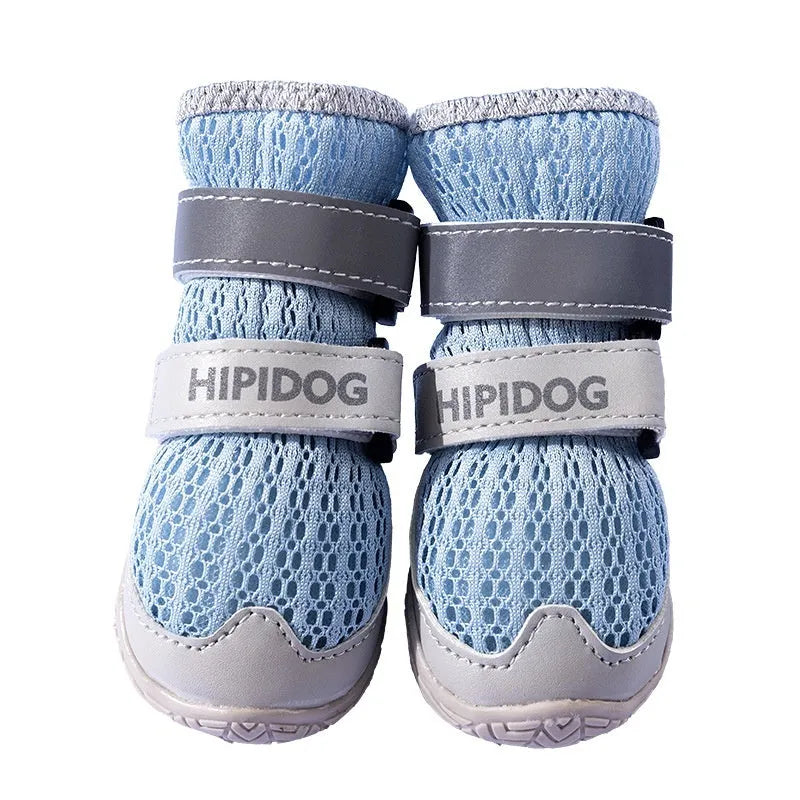 Pair of light blue cartoon-style dog shoes on a white background.