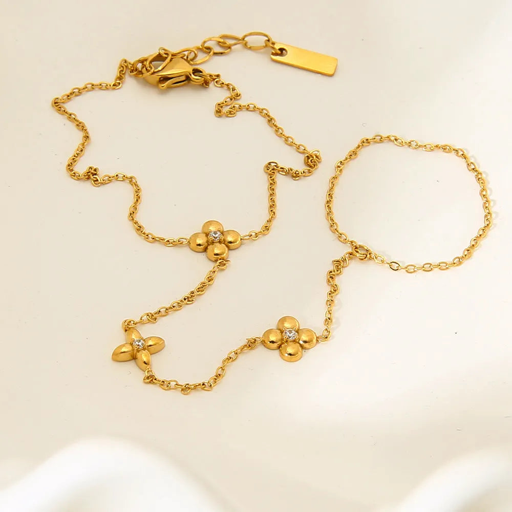 Gold stainless steel women's bracelet with flower and octagonal star geometric designs