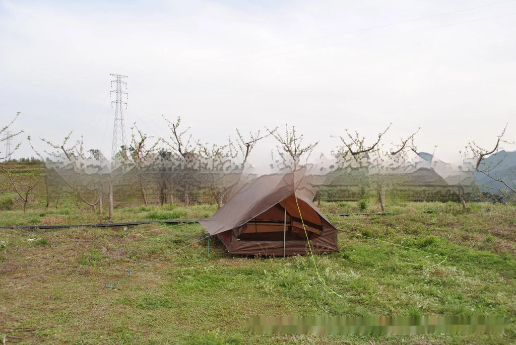 Brown A-line trekking tent pitched using hiking poles with dimensions 210x150x110cm