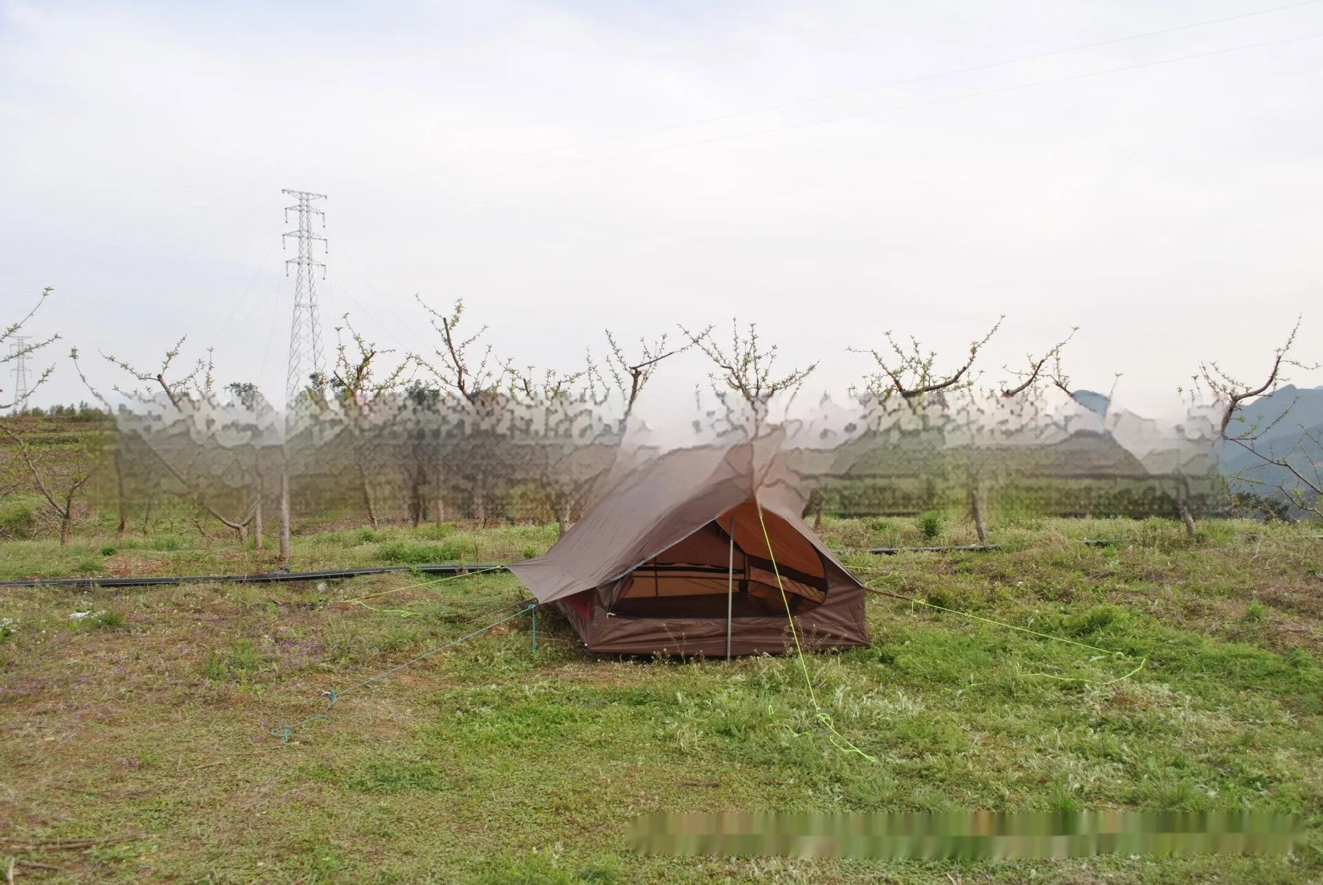 Brown A-line trekking tent pitched using hiking poles with dimensions 210x150x110cm