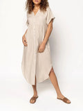 A loose-fitting, mid-length casual dress with a button-down front, shown in a solid colour.