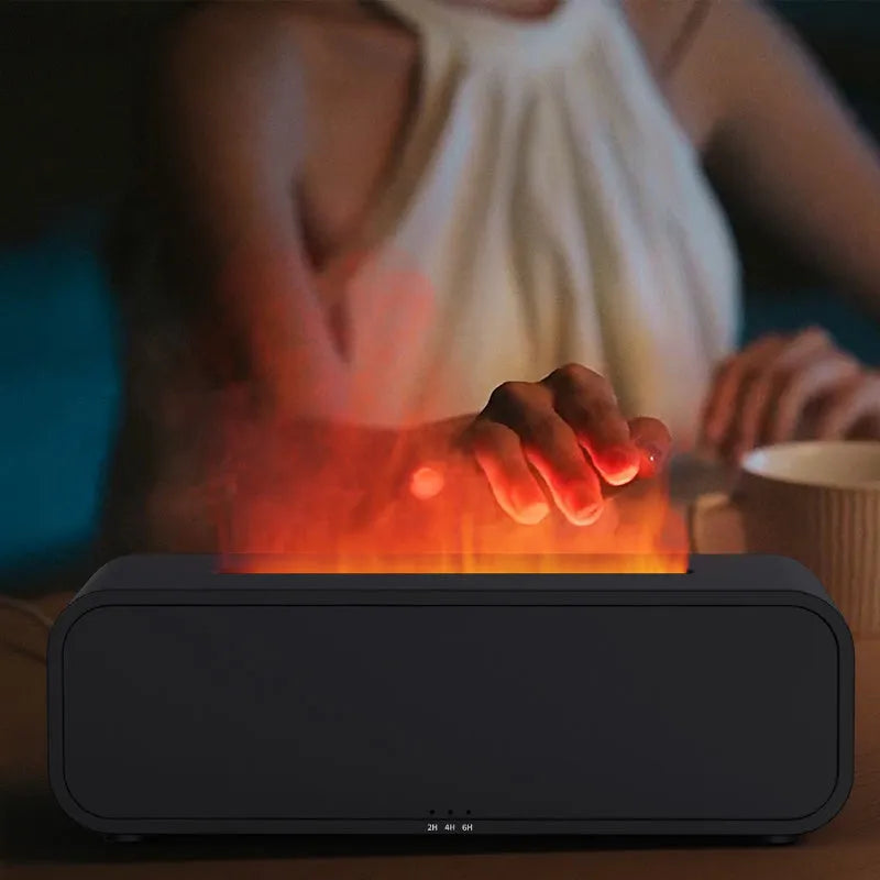 Black flame design aroma diffuser with remote control on a wooden table